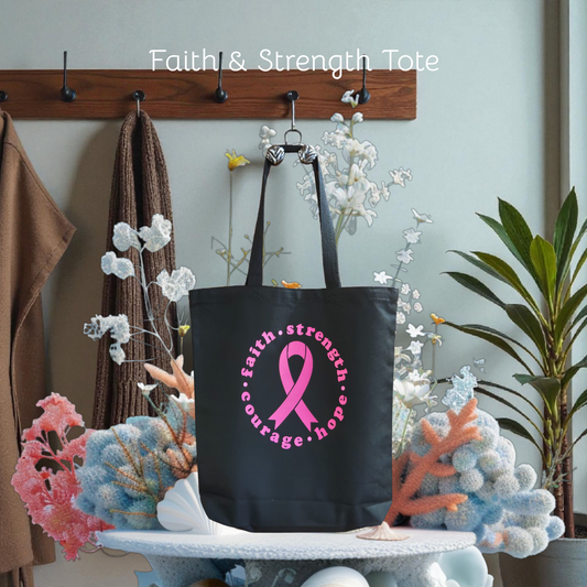 Black tote bag with pink ribbon and text on a decorative stand with flowers and plants.