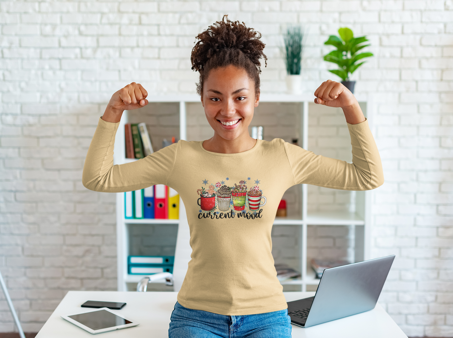 lilykae -long-sleeve-shirt-holiday-current-mood-woman-with-afro-hair-flexing-her-arms